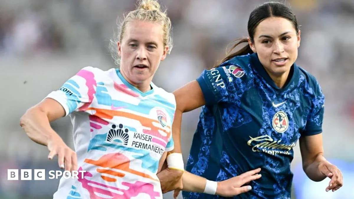 Two female players competing for the ball