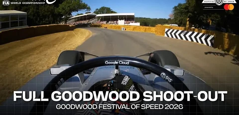 Formula E car navigating corner at Goodwood Festival