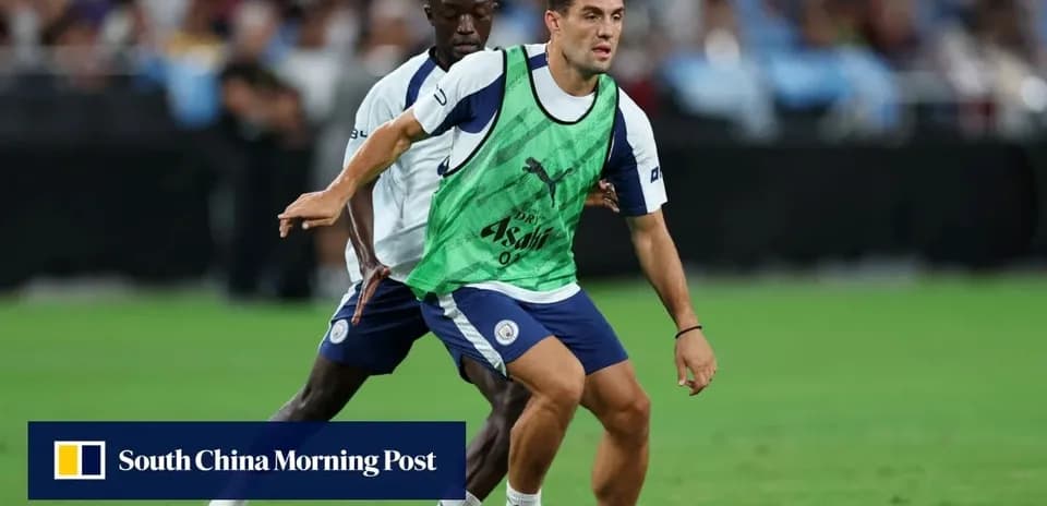 Two players training on the field with ball