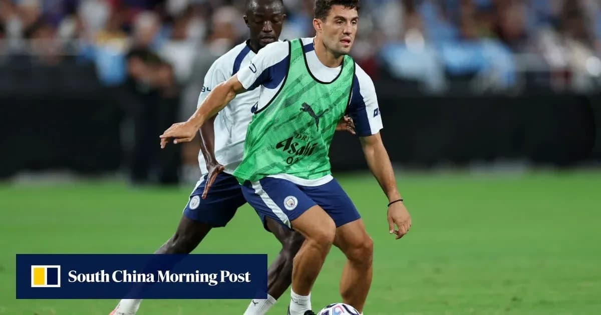 Two players training on the field with ball