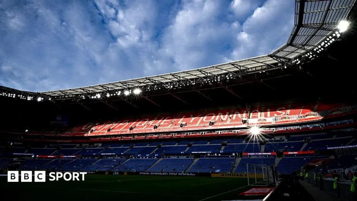 Empty stadium with bright lights and cloudy sky