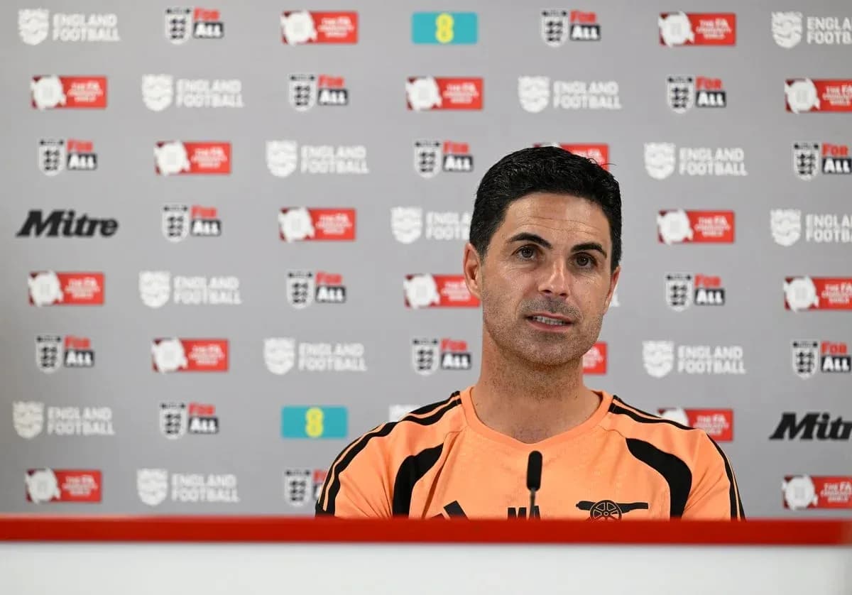 Mikel Arteta speaking at press conference table