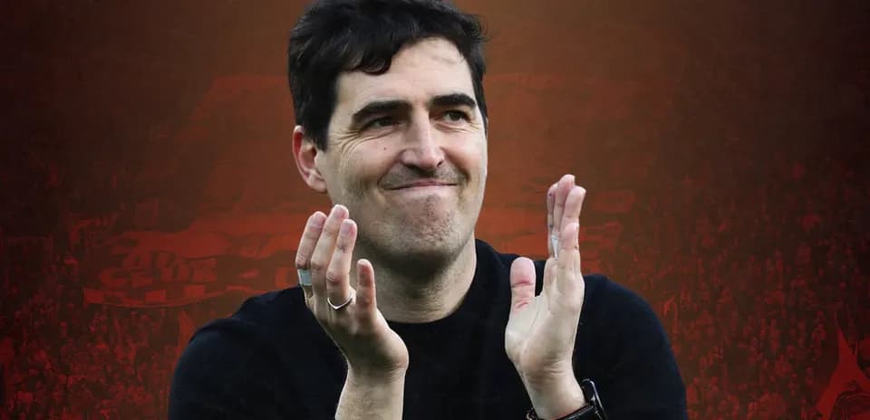 Man clapping in front of cheering crowd