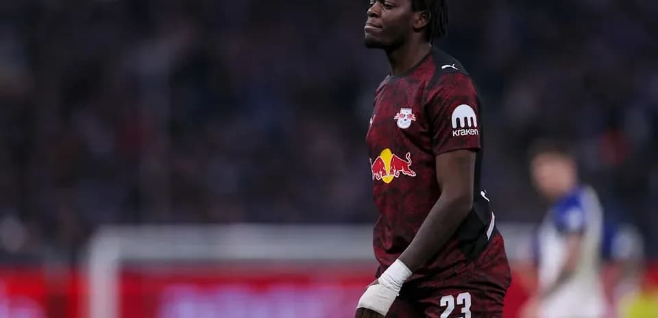 Goalkeeper in red uniform during match