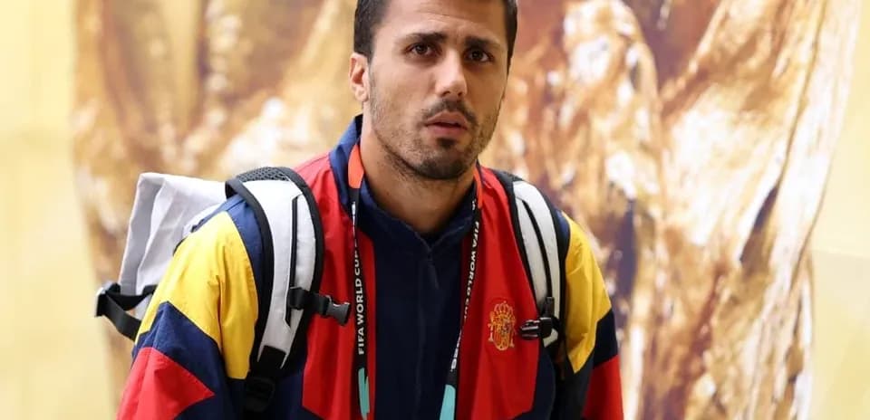 Athlete in colorful jacket with backpack at event