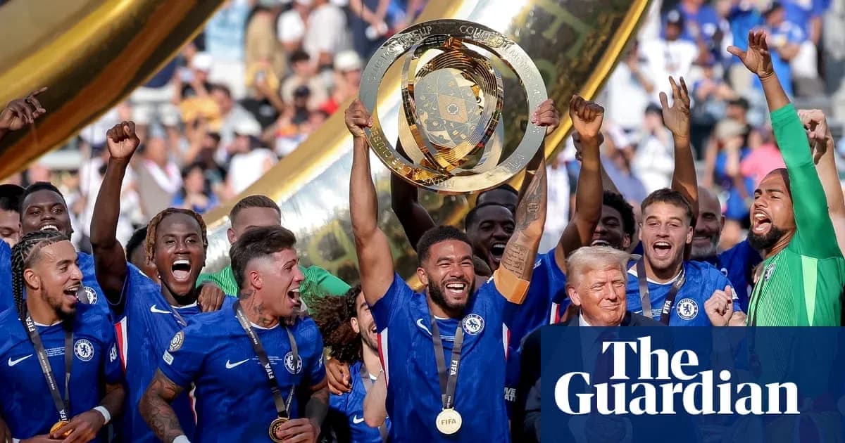 Chelsea players celebrating with trophy after victory