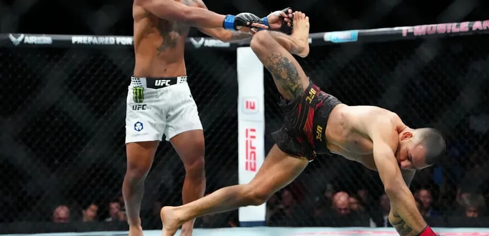 Fighters engaged in action during UFC match
