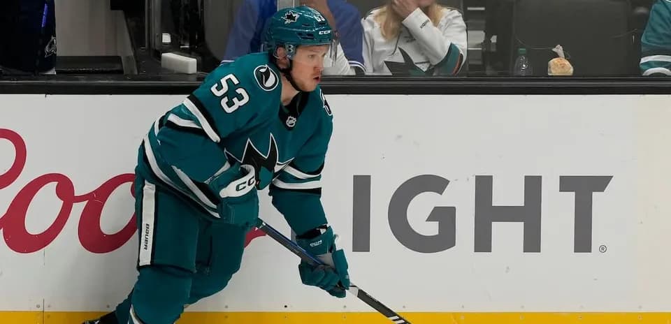 Hockey player skating near the bench during game