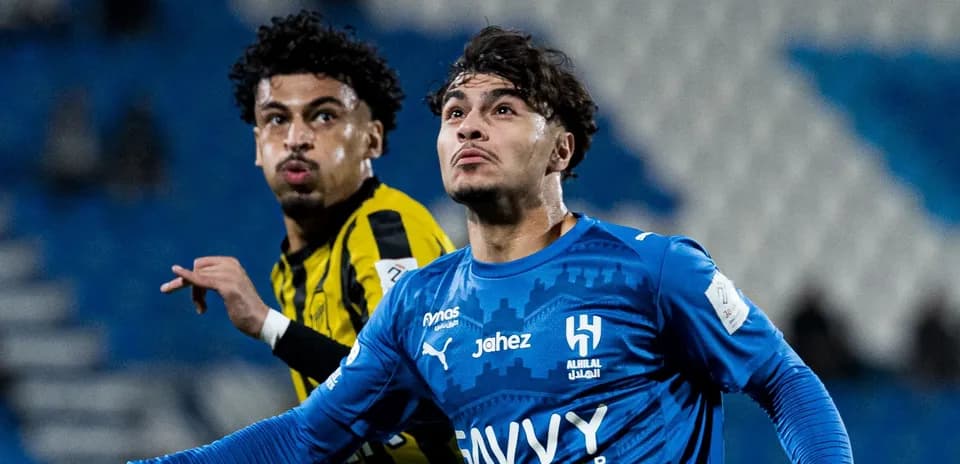 Two players competing for the ball during match