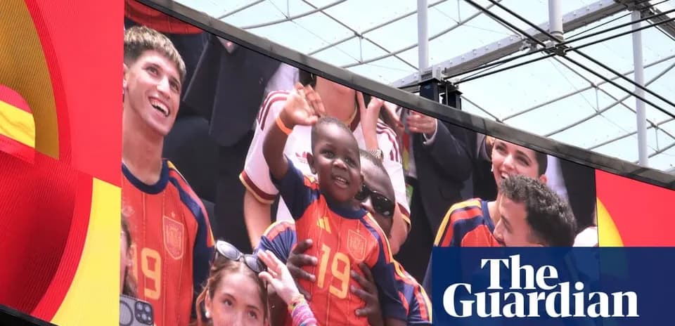 Fans celebrating together in Spain jerseys