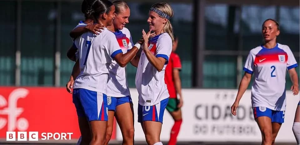 England women's team celebrating a goal on the field