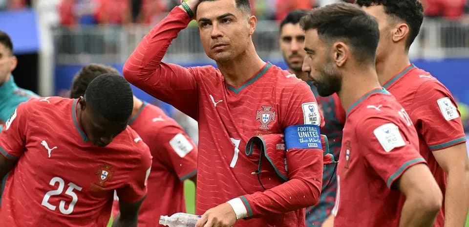 Cristiano Ronaldo and teammates during match huddle