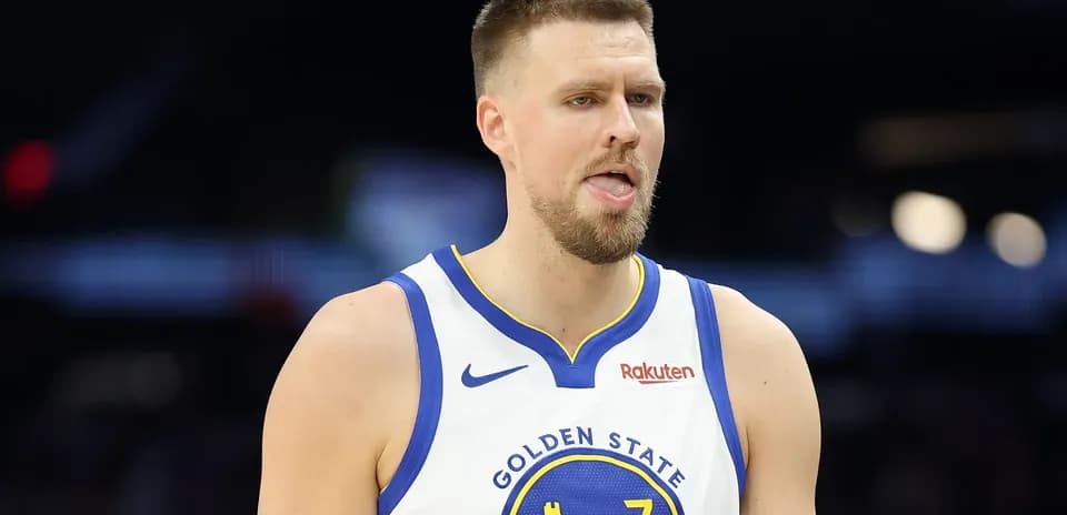 Basketball player in Golden State jersey during game