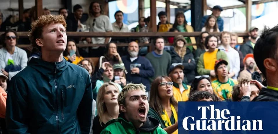 Fans watching sports event with focused expressions