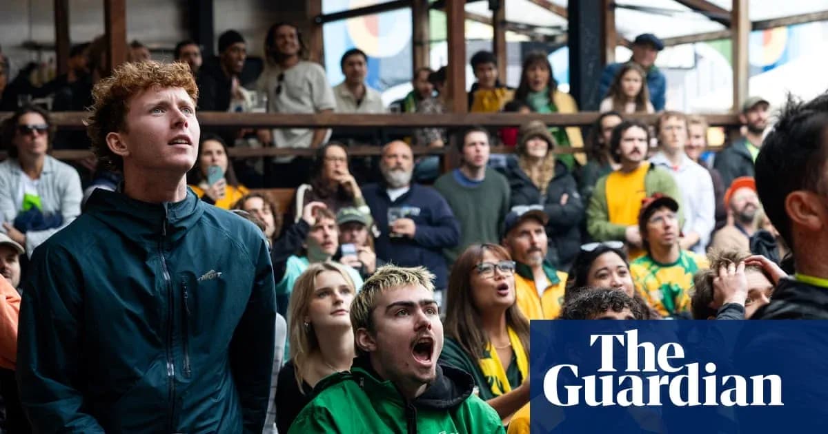 Fans watching sports event with focused expressions
