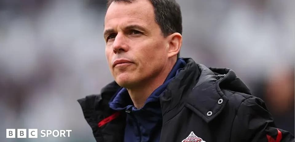 Sunderland manager observing match from sidelines