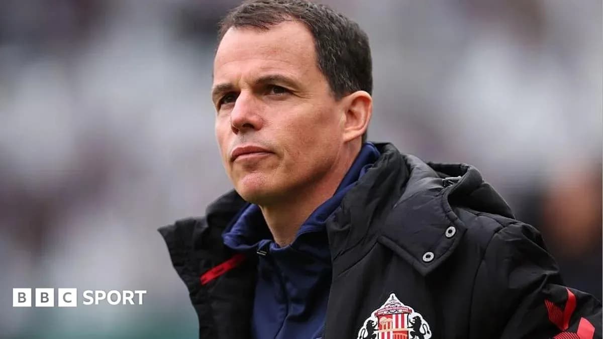 Sunderland manager observing match from sidelines