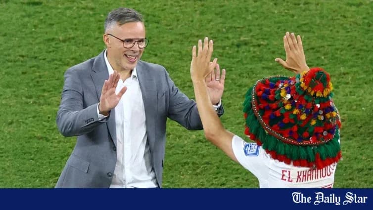 Coach celebrating with player after match victory
