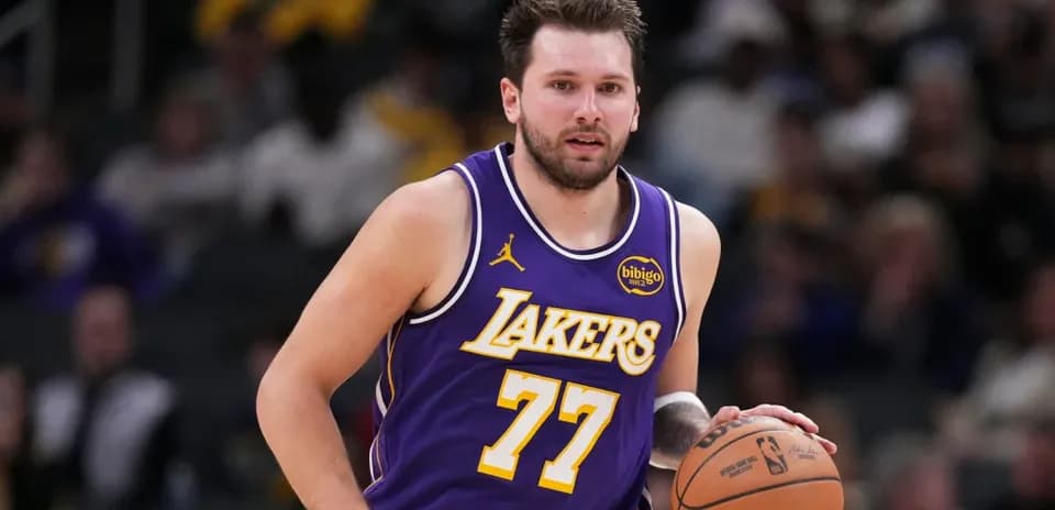 Lakers player dribbling basketball during game
