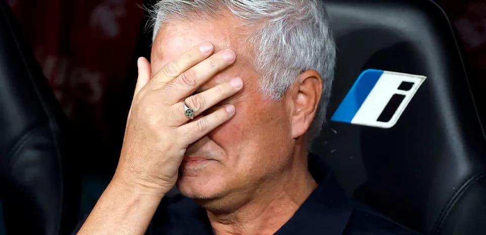 Mourinho covering his face during a match