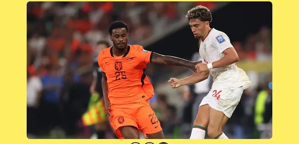 Holland and Morocco players contesting for the ball