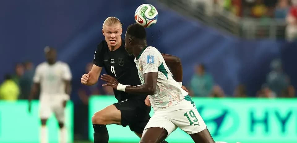 Two players contesting for the ball during match
