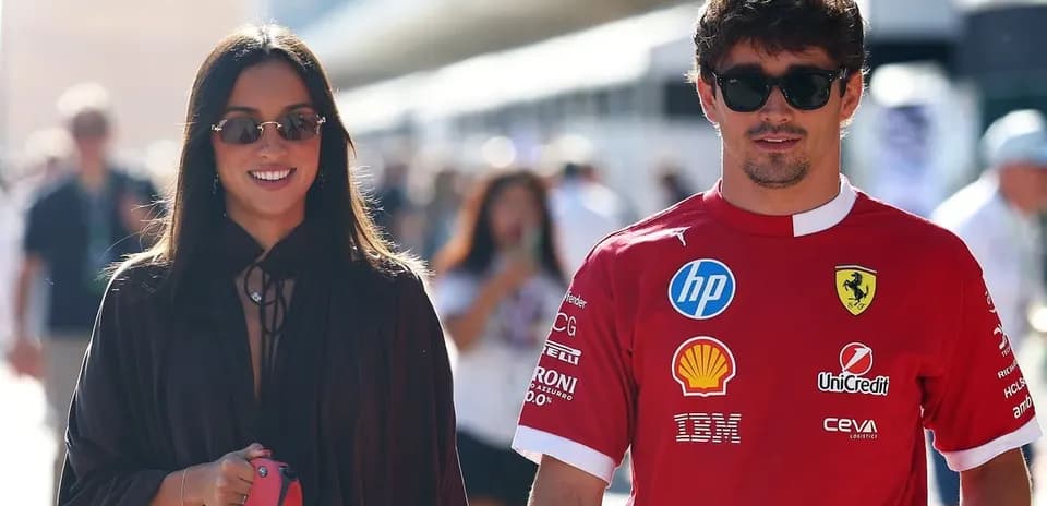 Pair walking together in casual attire at event
