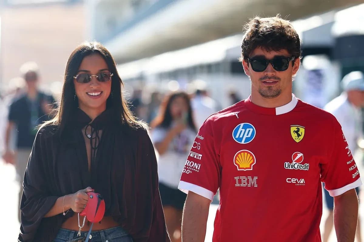 Pair walking together in casual attire at event