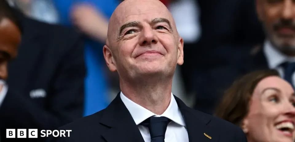 Man smiling in a crowd during an event