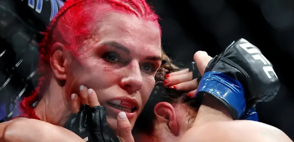 Fighters grappling in UFC match inside the octagon