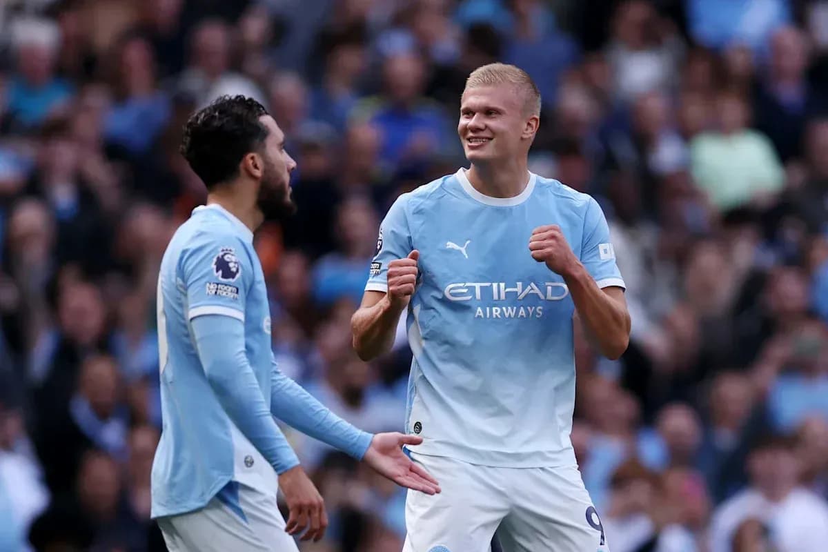 Manchester City players celebrating a goal on field