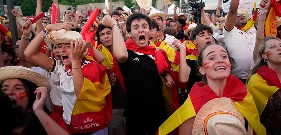 Fans celebrating with Spanish flags at event