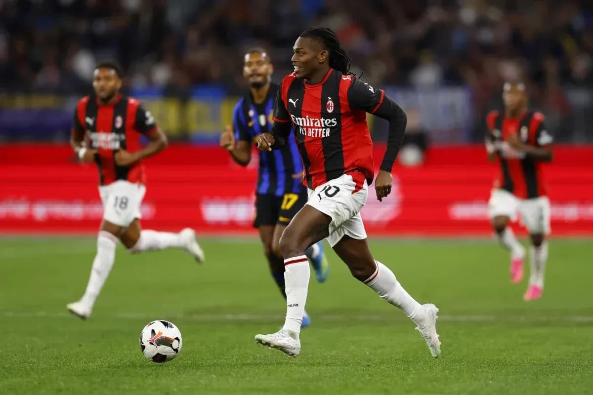 Milan player dribbling ball during match against opponent
