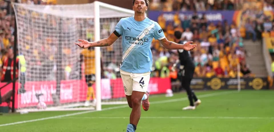 Manchester City player celebrating a goal on pitch
