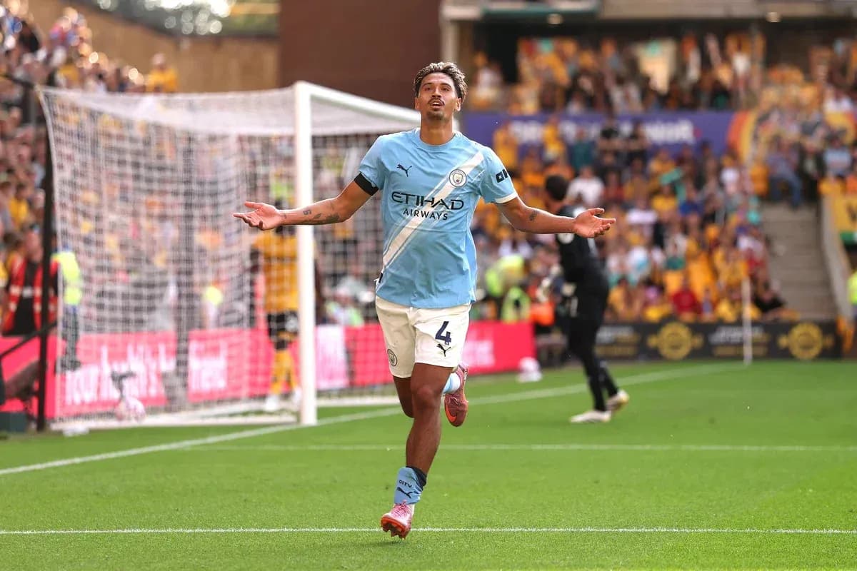 Manchester City player celebrating a goal on pitch