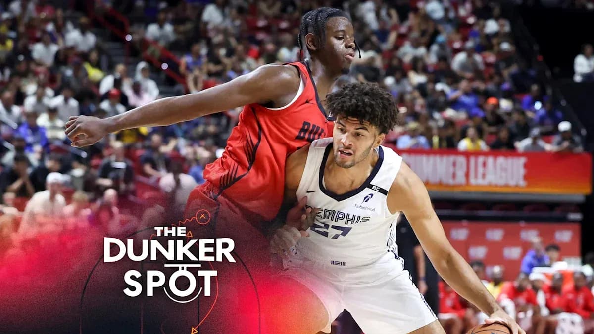 Two basketball players competing during summer league game