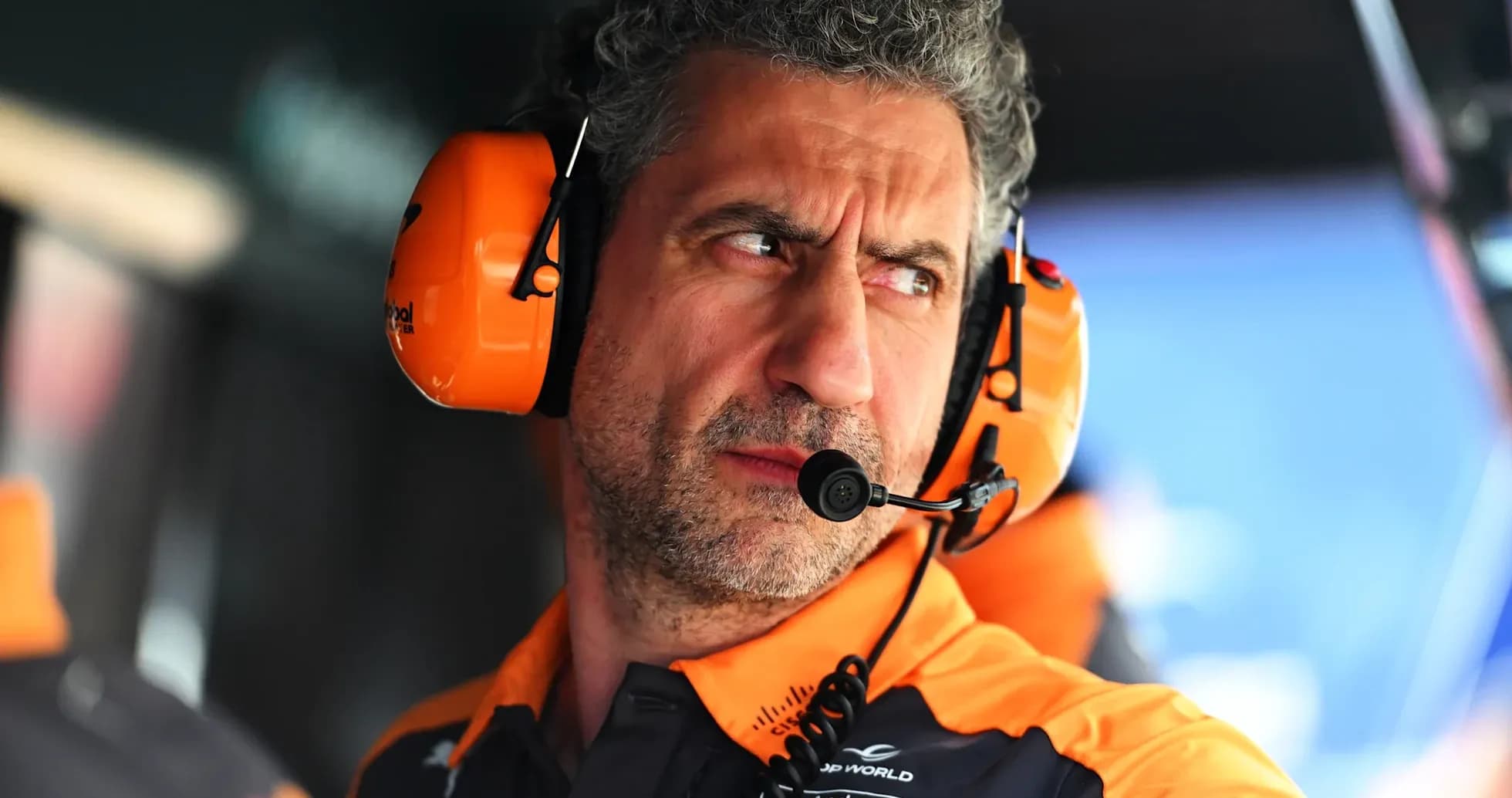 Team member wearing headset in pit area