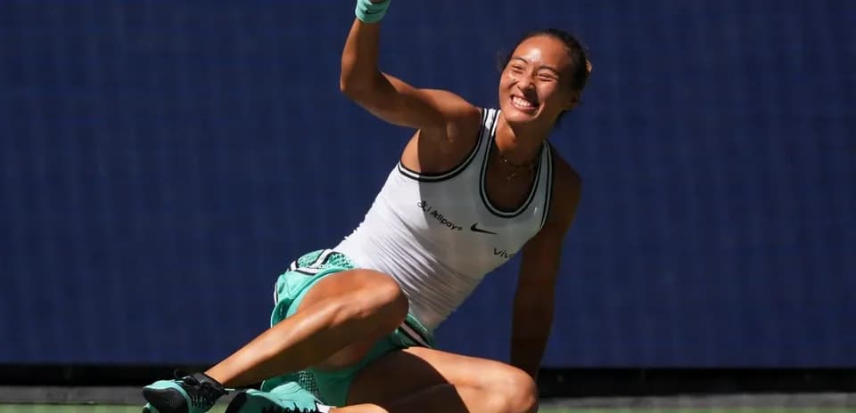 Tennis player celebrating on the court after winning point