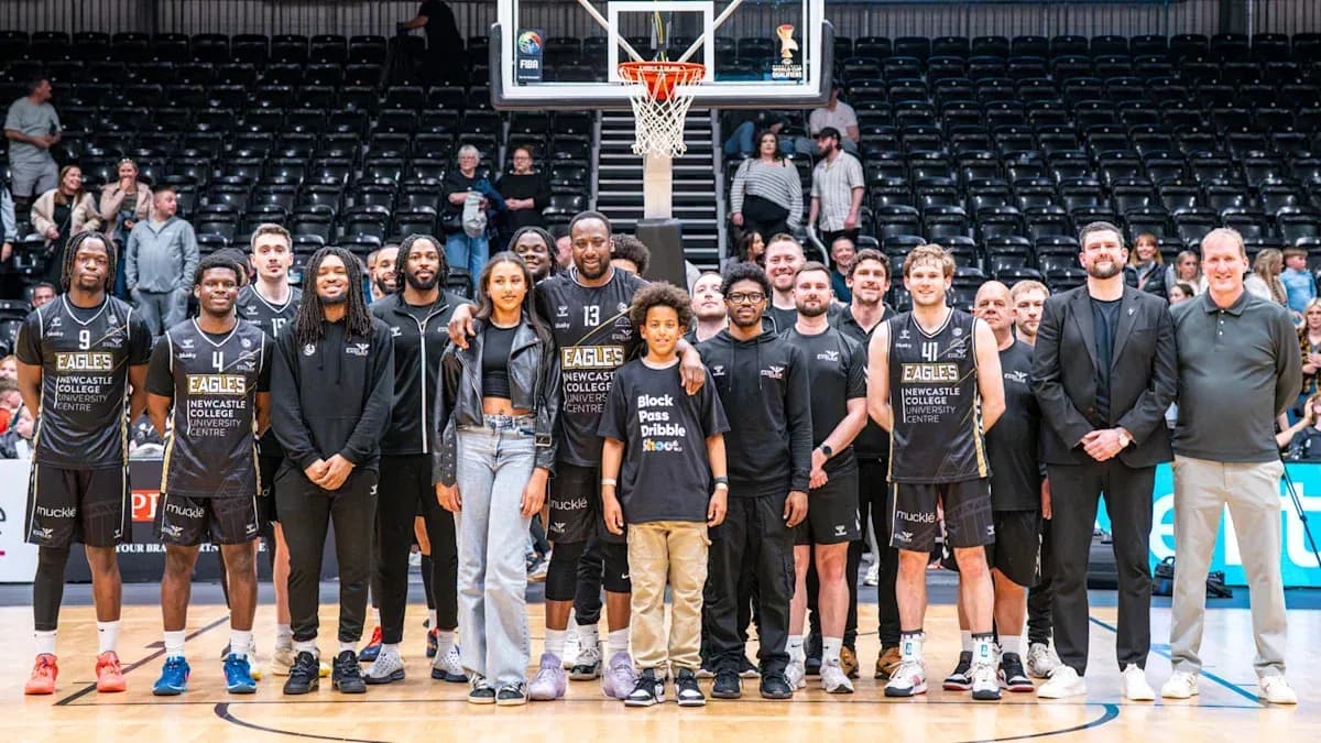 Newcastle Eagles team posing on basketball court