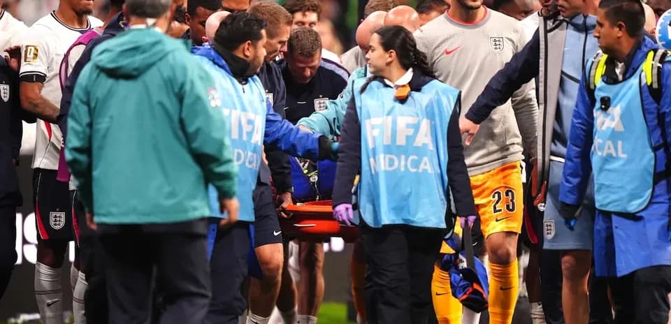 Players and medical staff attending to injured player