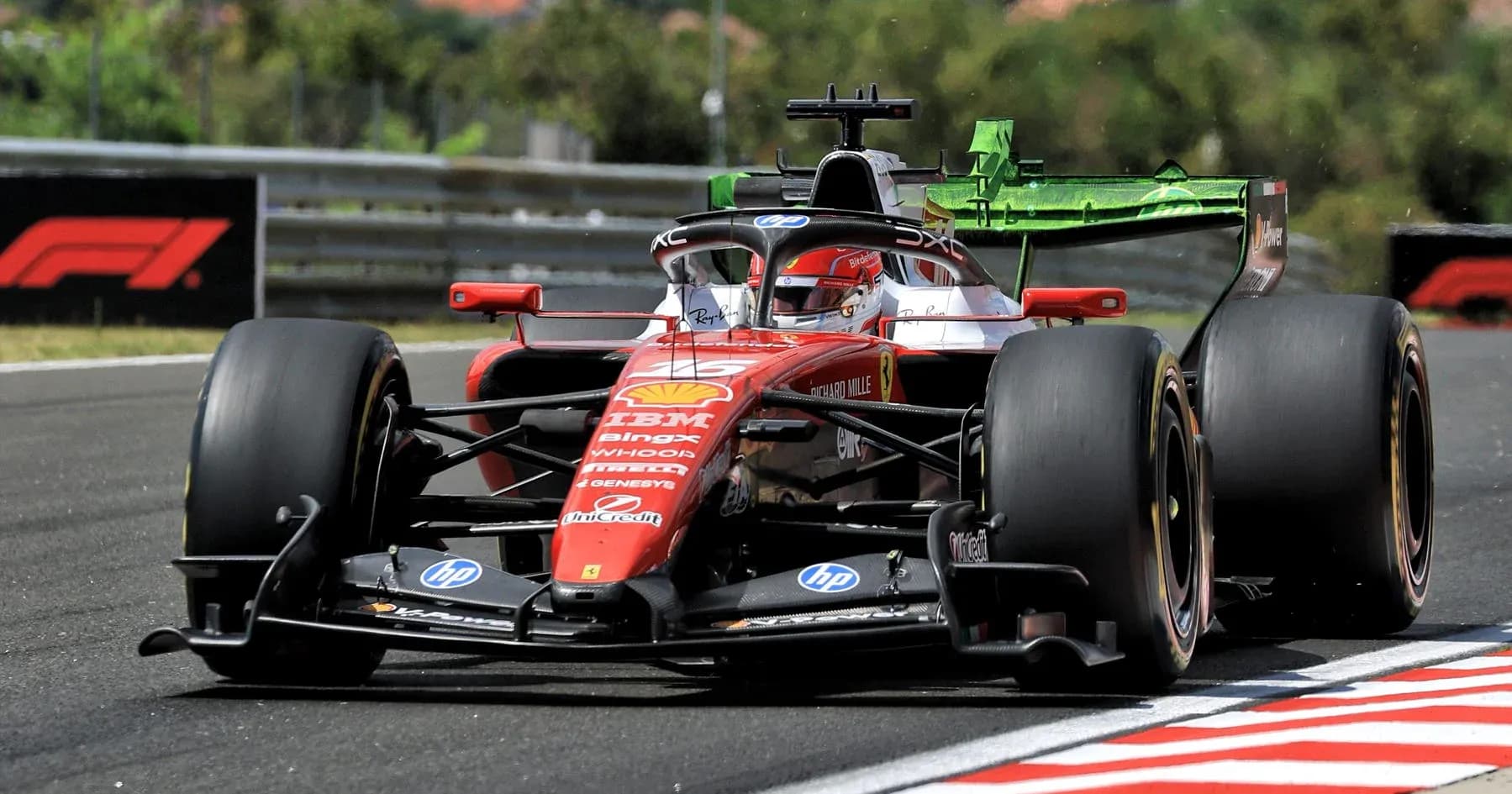 Ferrari F1 car racing on track during competition