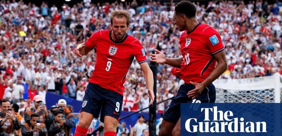 Harry Kane celebrating with teammate after scoring