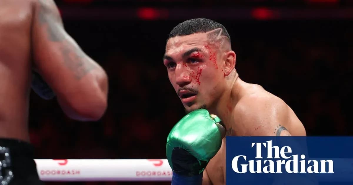 Boxer with blood on face during match