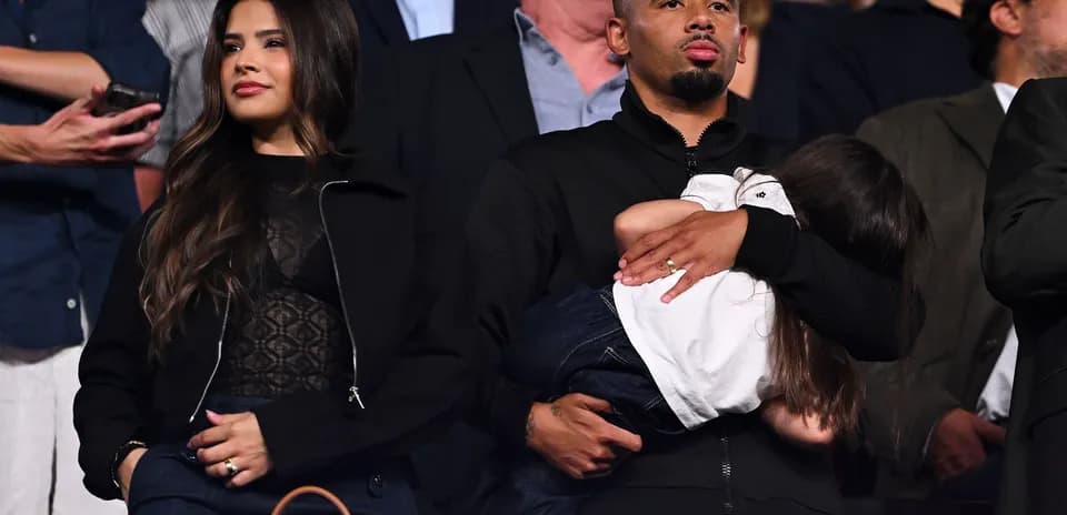 Couple attending event with child in arms