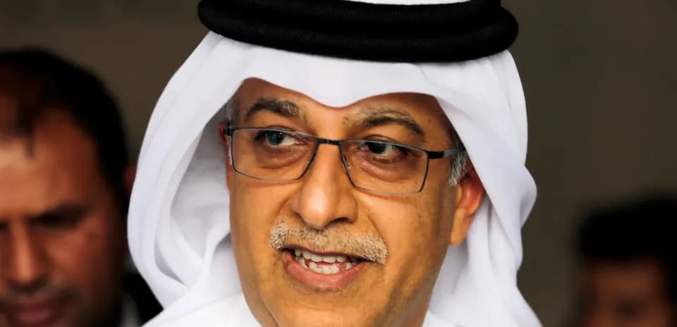 Shirted man wearing traditional headwear speaking