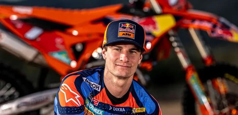 Motocross rider posing with KTM bike