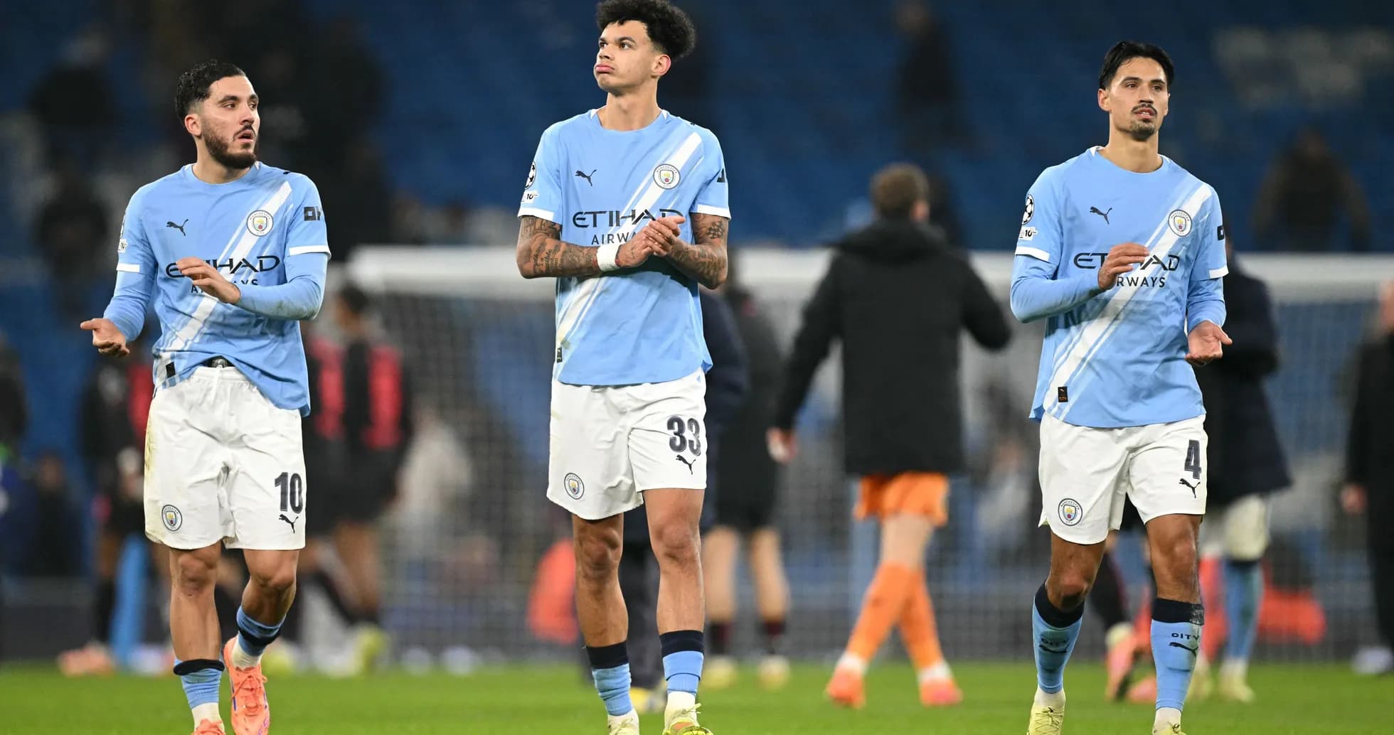Manchester City players walking off the pitch