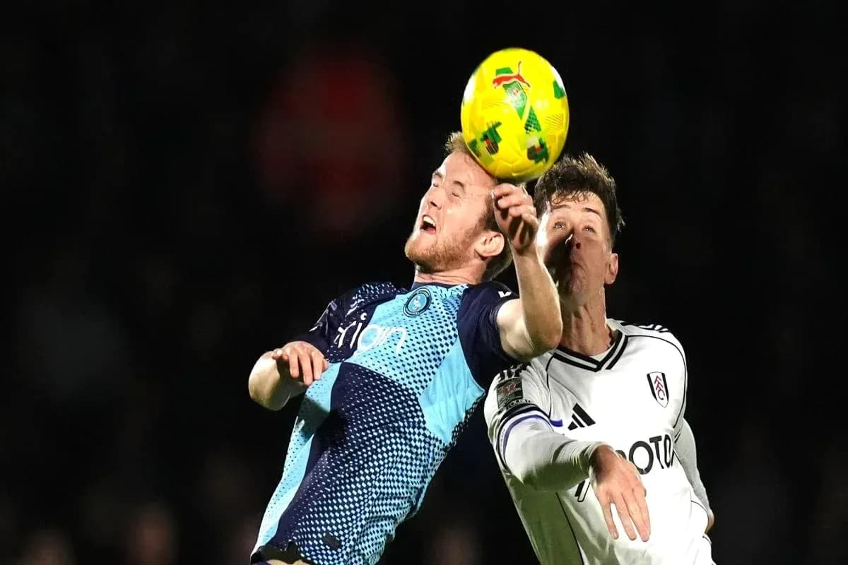 Two players contesting a header during match