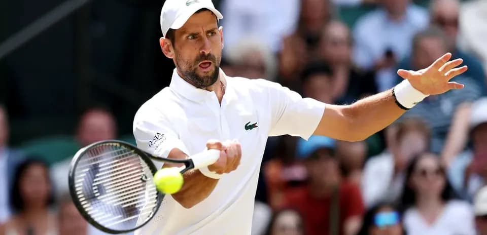 Tennis player hitting a forehand during match