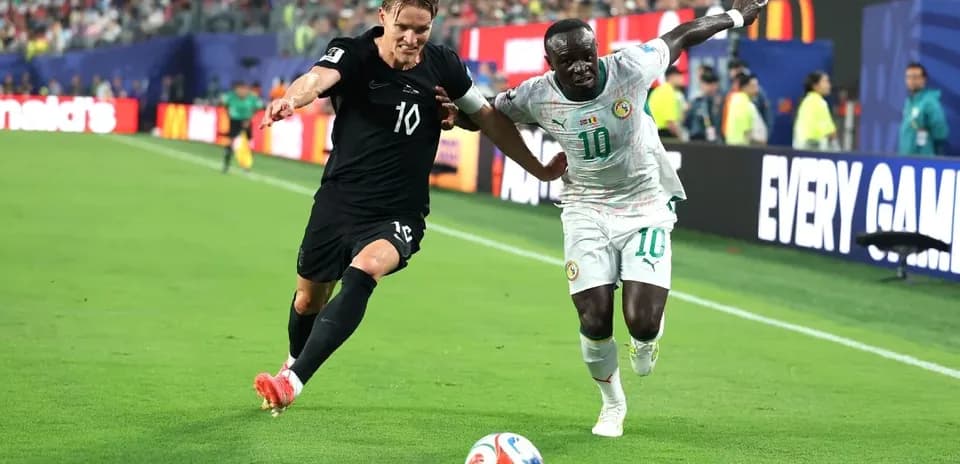 Two players contesting the ball during a match